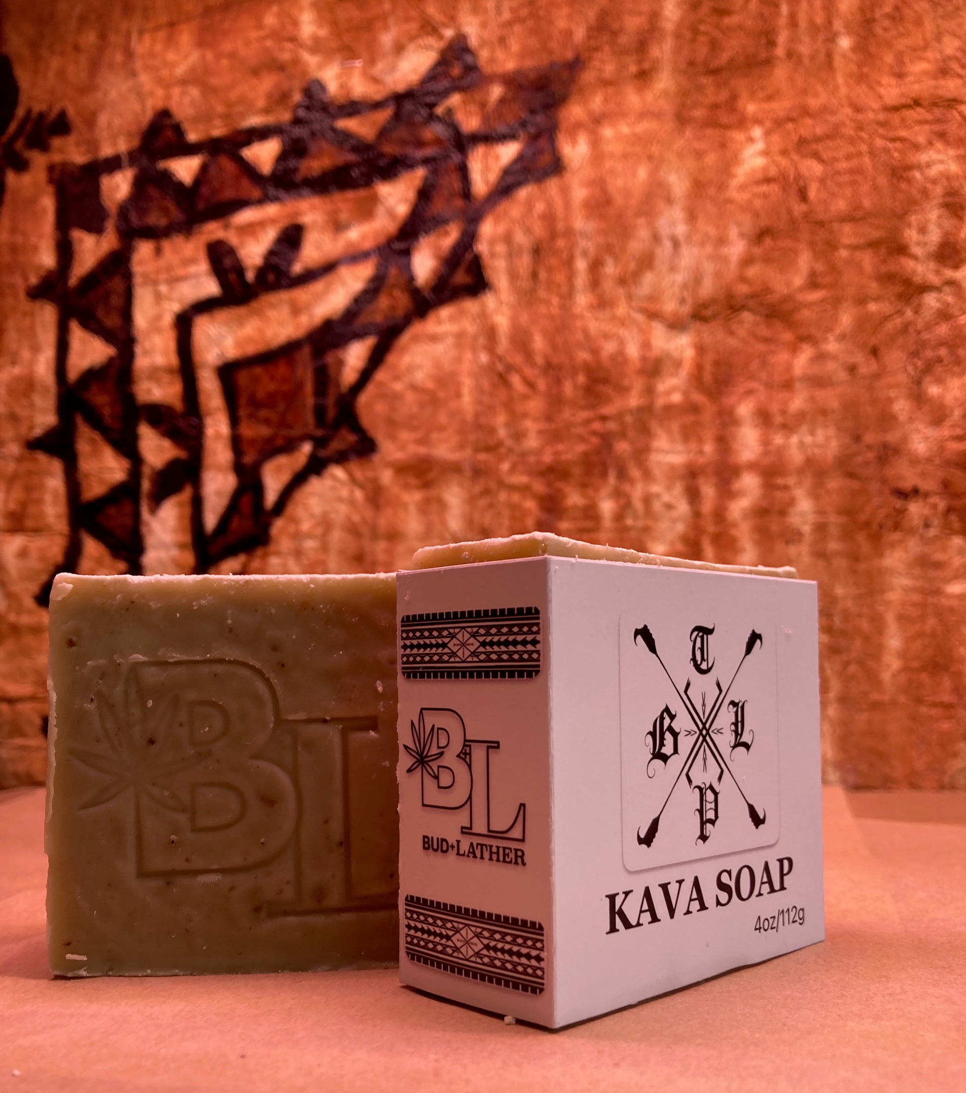 Kava soap bar and packaging with a decorative background