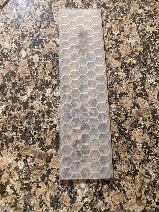 Silicone Mat with Hexagonal Honeycomb pattern, lying on a granite surface