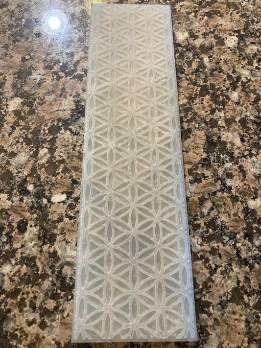 Rectangular silicone mat with geometric pattern on a granite surface