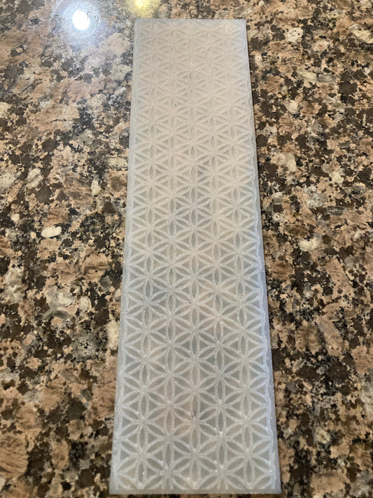 Rectangular silicone mat with geometric pattern on a granite surface